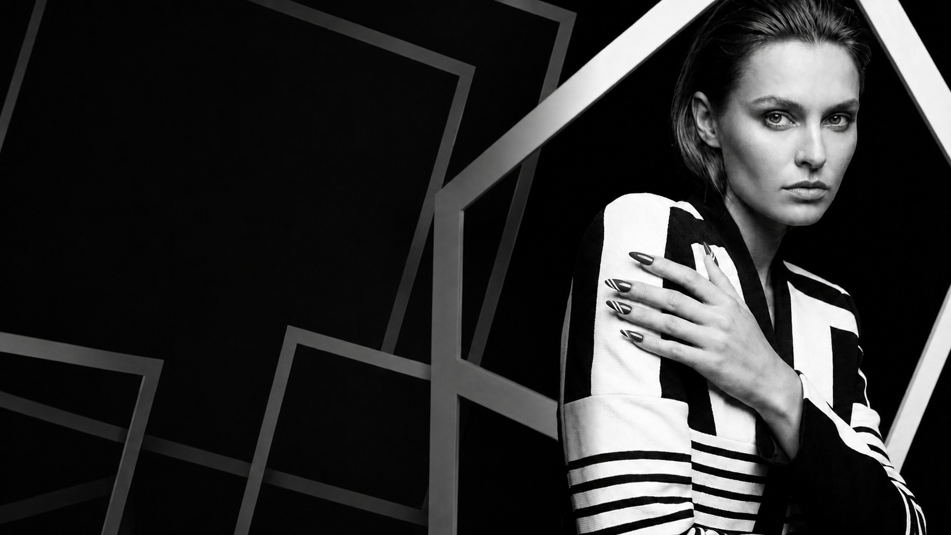 Black-and-white Vittorio Vittoria campaign portrait framed by geometric lines