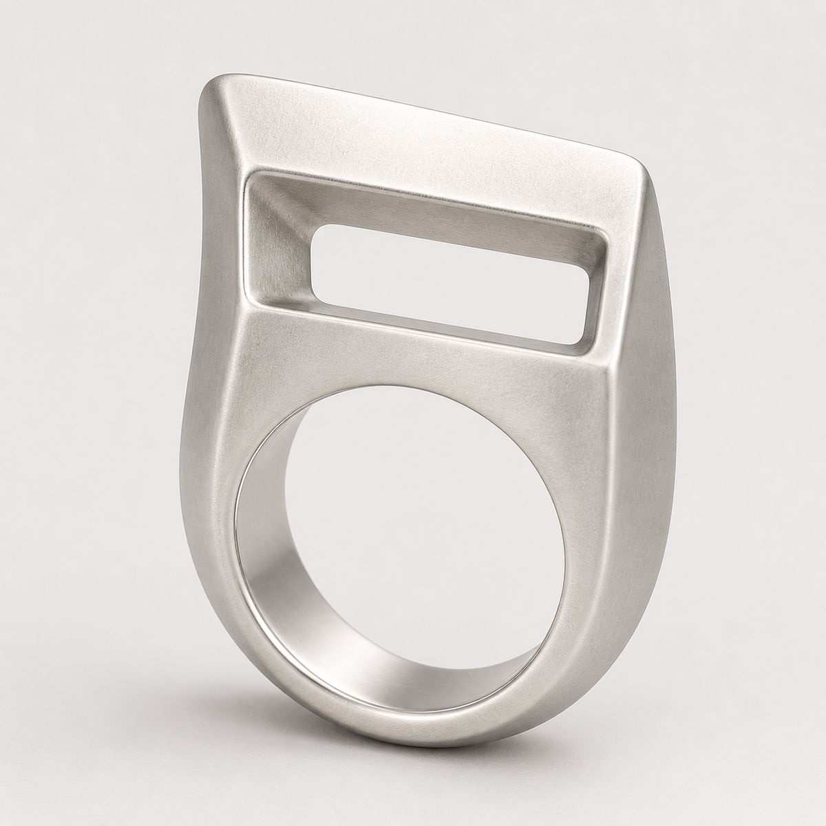 Offset Portal Ring in sterling silver on a neutral studio background