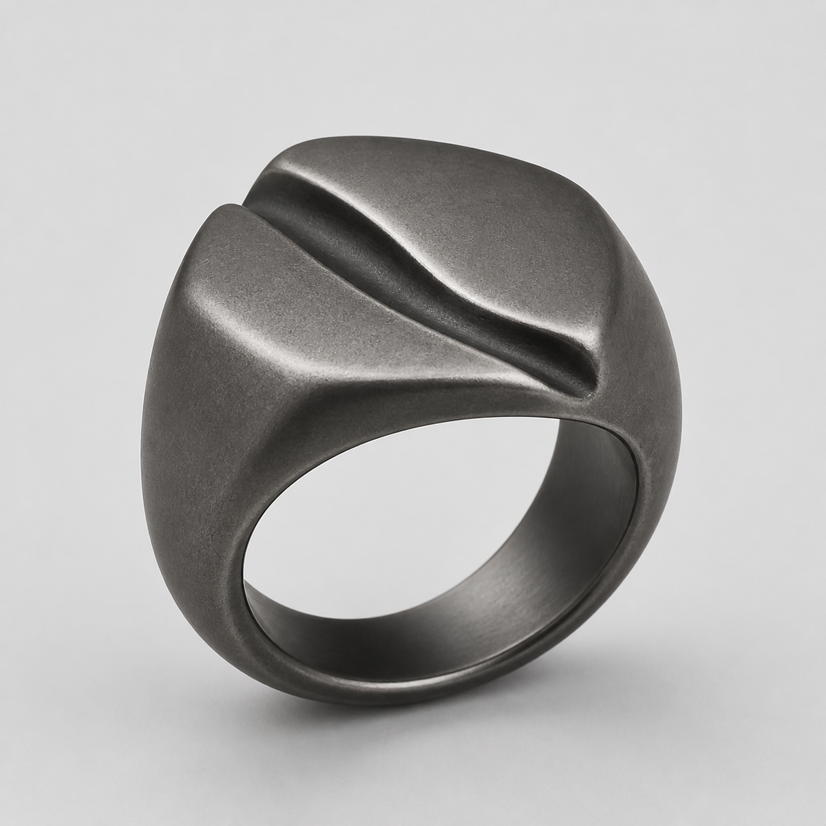 Fault Line Signet Ring in sterling silver on a neutral studio background